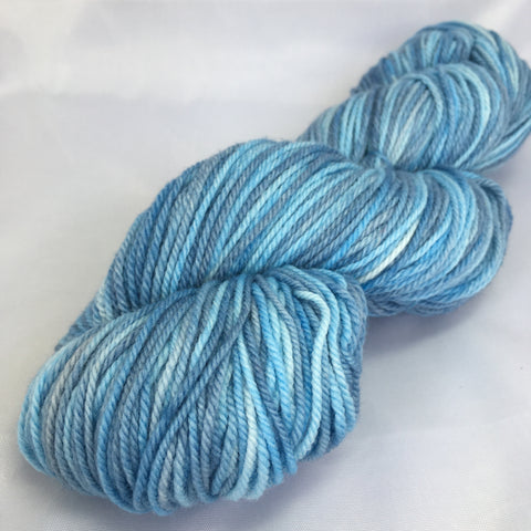 Skein of medium blue gray variegated yarn