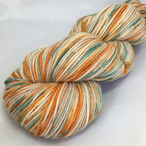 pale brown, orange, and teal variegated yarn